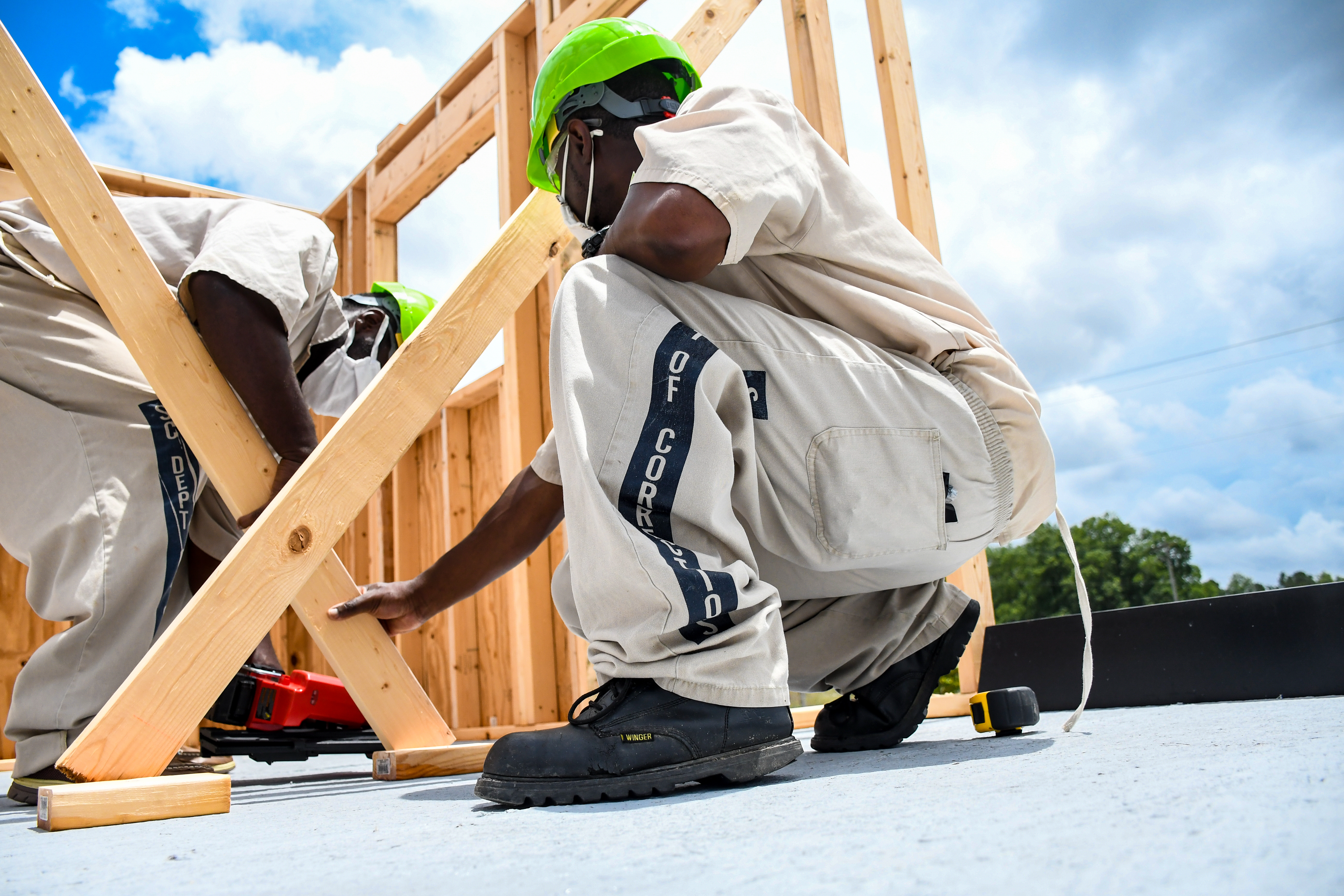 Inmate building the frame to a structure