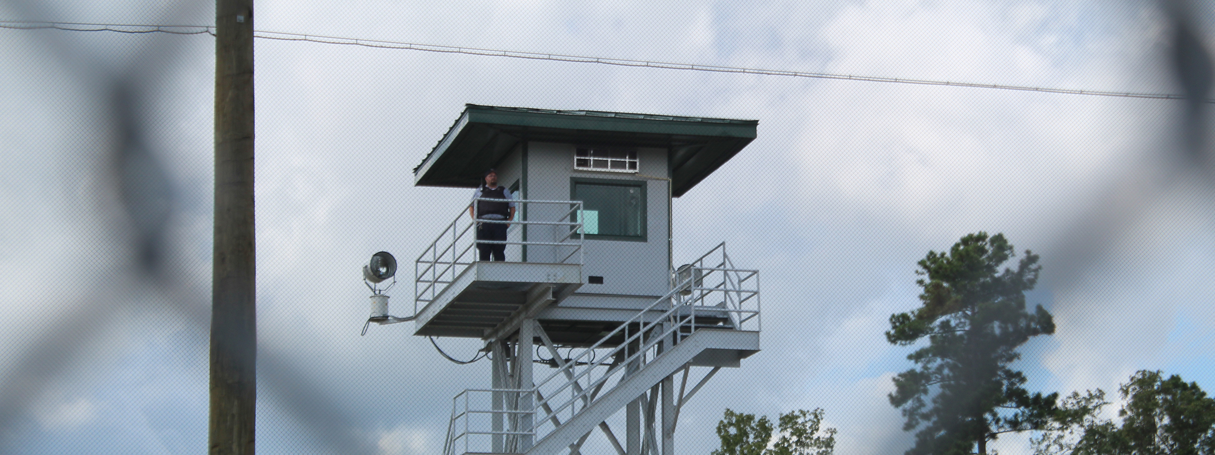 Guard Overseeing Prison from Guard Tower