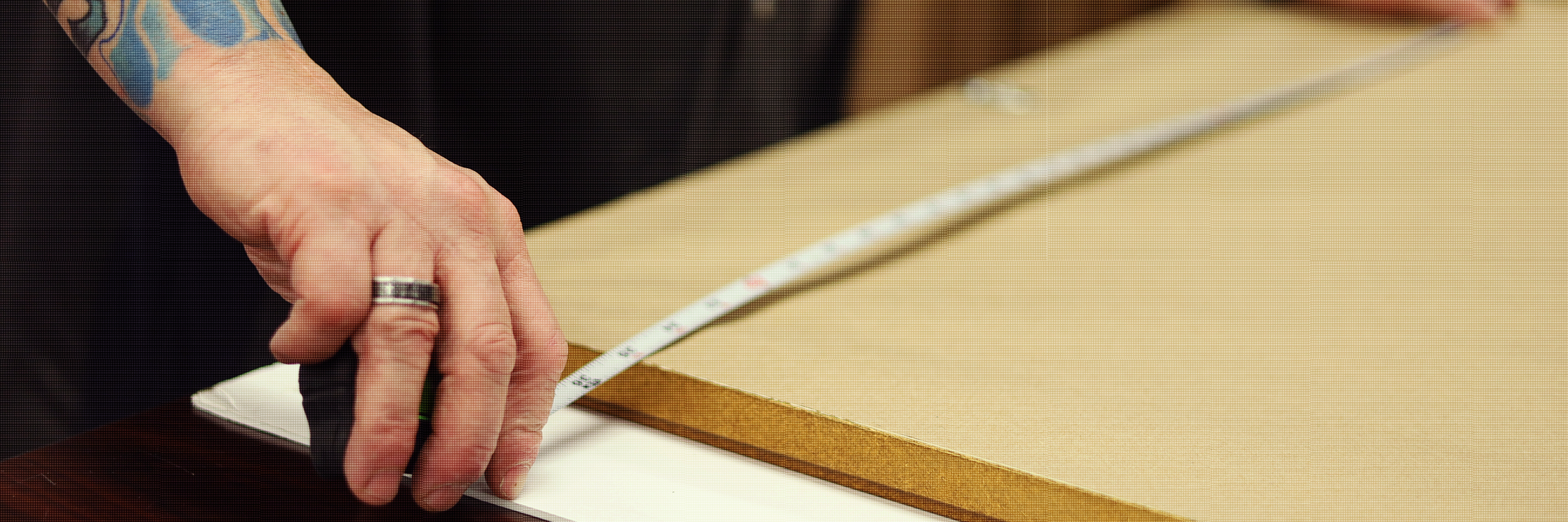 Inmate Measuring a Picture Frame