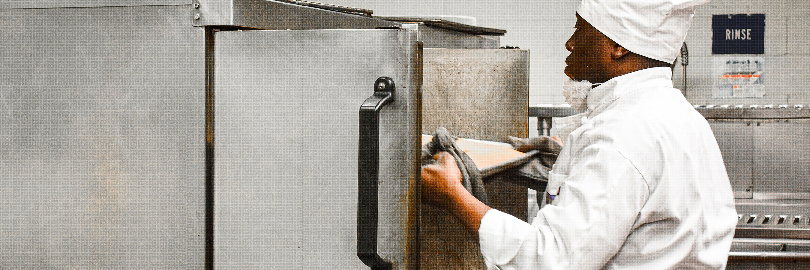 Food Service Specialist Placing Tray in a Fridge